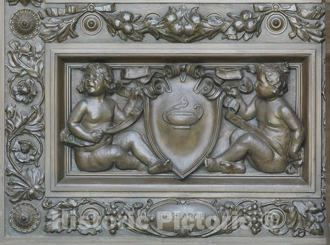 Photo- Exterior View. Detail of Bronze Doors at The Main Entrance with Cherubs Representing Truth (Holding a cartouche with Mirror and a Serpent), by Olin L. Warner 2