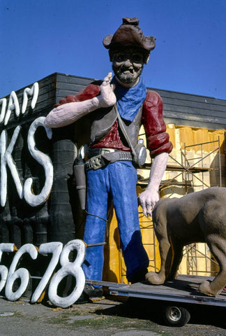 Historic Photo : 1987 Spray foam trucks prospector statue and sign, entire statue detail, Frontage Road, I-5, Albany, Oregon | Photo by: John Margolies |