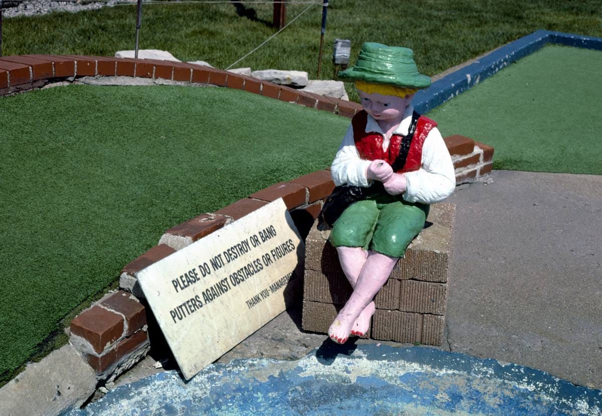 Historic Photo : 1986 Lad and vandalism sign, Jawor's Fun Golf, Roseville, Michigan | Margolies | Roadside America Collection | Vintage Wall Art :