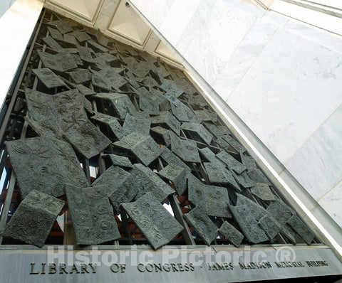 Photo- Exterior View. Falling Books, by Frank Eliscu, a Four-Story Relief in Bronze Over The Main Entrance. Library of Congress James Madison Building, Washington, D.C.