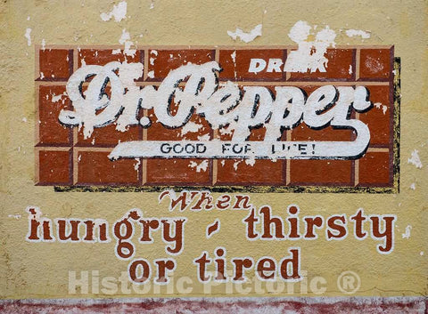 Photo- What's left of an old Dr. Pepper beverage advertising sign on the wall of a vintage gas station at the Buffalo Gap Historic Village in the unincorporated Taylor County 2