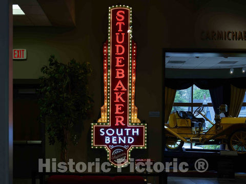 Photo - Neon Advertising Sign at The Studebaker Museum in South Bend, Indiana, That Presents a Variety of Automobiles, Wagons, Carriages- Fine Art Photo Reporduction