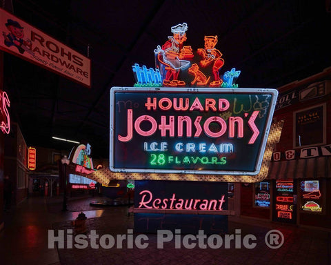 Photo- A Classic Outdoor neon Sign Advertising one of The Locations of The Howard Johnson's Motel and Restaurant Chain, is one of Hundreds of Advertising Signs, placards