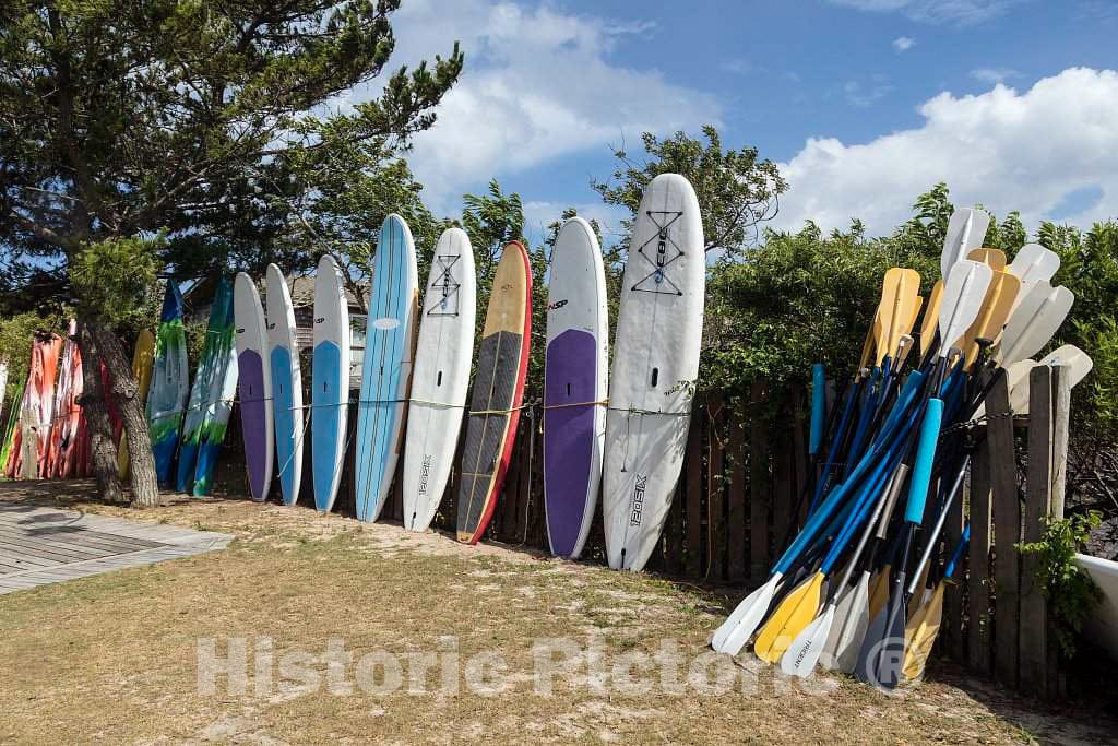 Photo- Kayaks, Windsurfer Boards, and Paddles at North Duck Watersports in Duck, a Community Named for The Plethora of Waterfowl in The Area, in North Carolina's Outer Banks