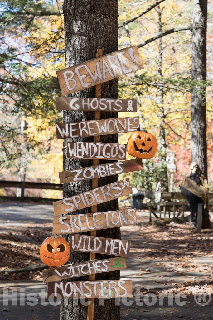 Photo- A Spooky Variation on The Familiar Array of Direction and Distance Signs, Part of The Fun of a Halloween Themed Tour of The Hickory Ridge Living History Museum in Boone
