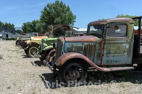 Photo- Old Trucks, Used to haul Fruit from Nearby Orchards in Grand Junction, Colorado. The Vehicles are displayed at The Museum of Western Colorado's Cross Orchards Historic Site