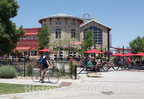 Photo - A Cyclist Arrives at The Finish line of a Bike Rally Outside The Odell Brewing Company in Fort Collins, Colorado- Fine Art Photo Reporduction